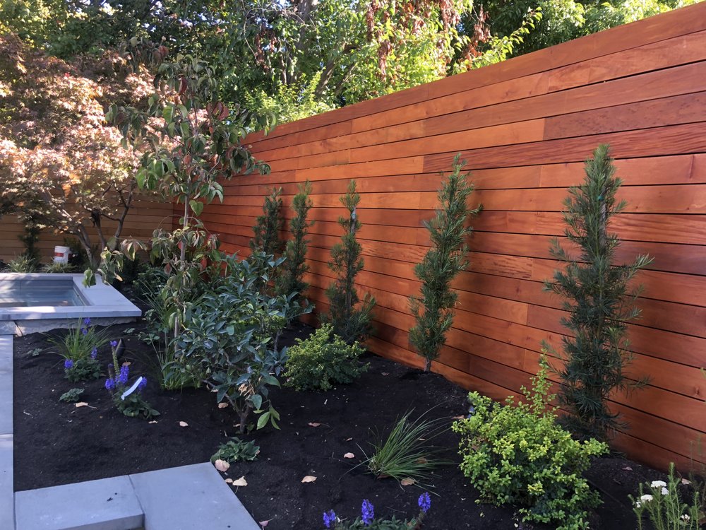 Cedar privacy fence with new planting bed and spa
